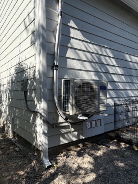 Exterior MR. COOL ductless mini-split condenser installed by K&K ProBuild