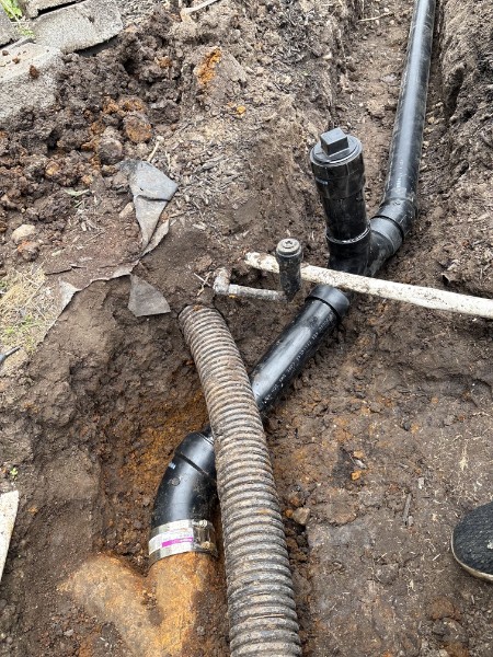 New ABS sewer lines and clean-outs run for a 100-foot sewer addition