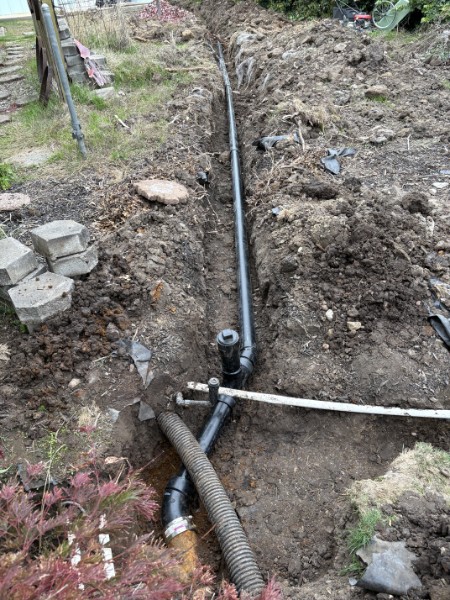 Open trench for a 100-foot sewer line addition serving a new ADU